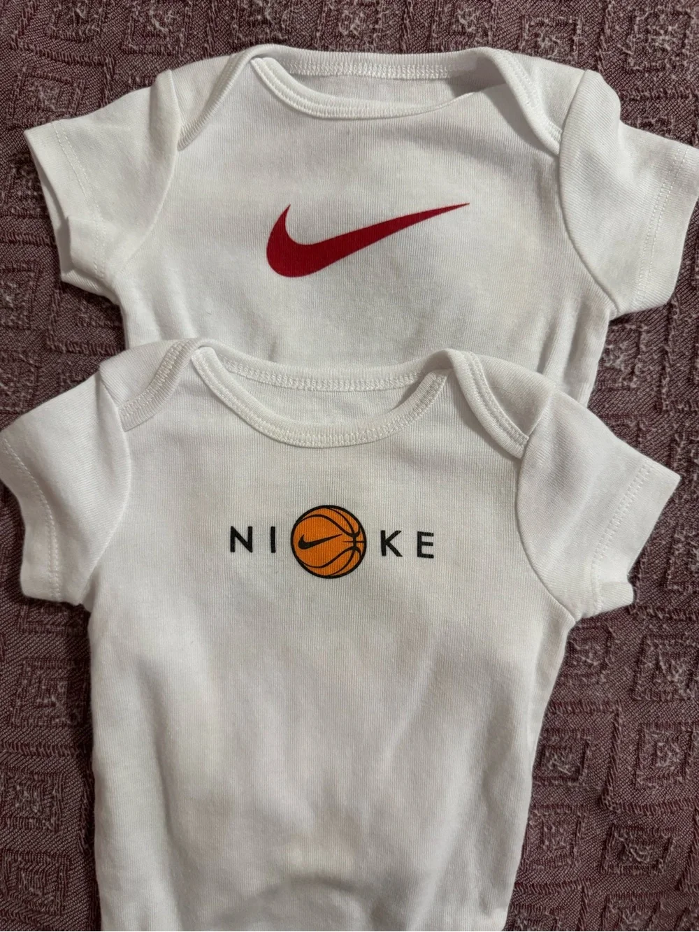 Nike baby onesies